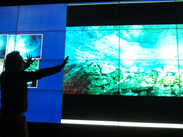 Archaeologist Beto Nava experiencing his data on the V-Room wall during a collaborative brainstorming session of how layered realities and digital data annotation could help their underwater project. 